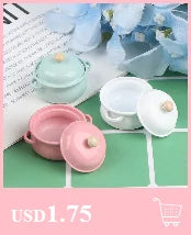 Pink and mint green miniature copper soup pots for a dollhouse kitchen display