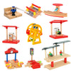 A set of wooden train track accessories featuring airport and gas station scenes with various vehicles and structures.