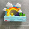 A colorful bath toy set featuring a rainbow arch, clouds, and yellow ducks on a blue base.