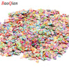 A pile of colorful soft polymer clay slices assorted for nail art and DIY crafts