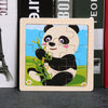 A wooden tangram puzzle depicting a panda face in a blue landscape.