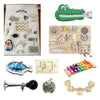 A collection of wooden Montessori busy board toys including puzzles, gears, and manipulative tools for sensory learning.