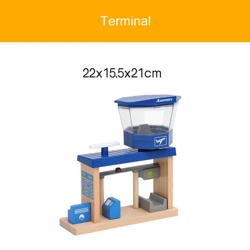 A wooden train track accessory set featuring an airport and gas station scene.