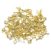 A pile of vintage gold-colored metal key charms for DIY jewelry making
