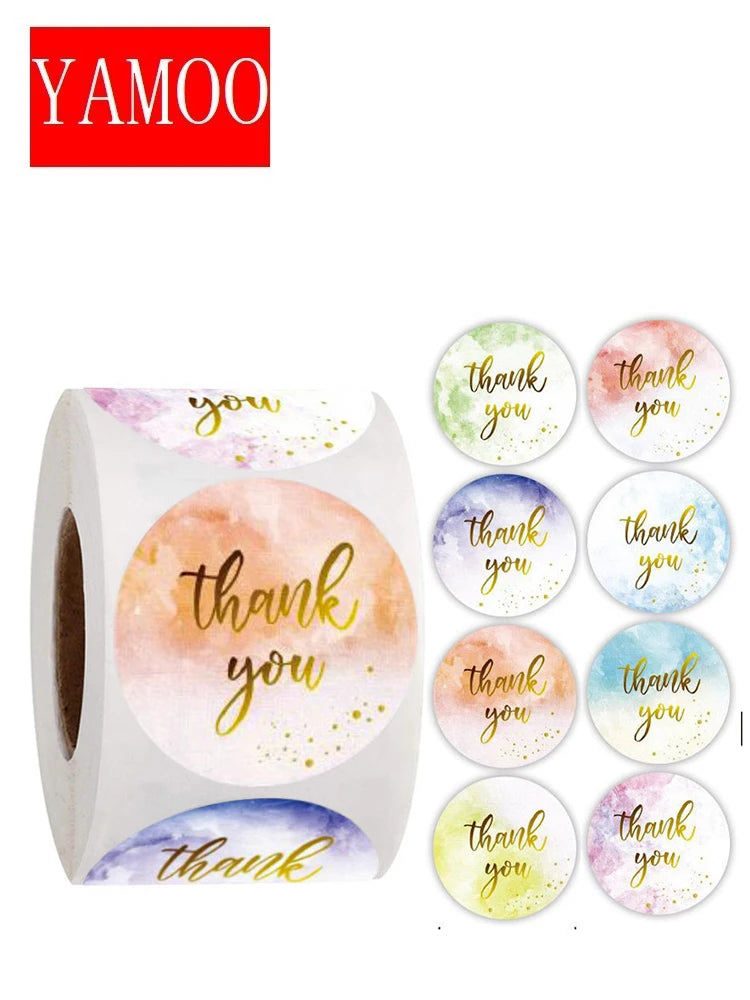 A roll of white paper with watercolor designs featuring 'thank you' in various colors like pink, orange, and blue.