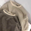 A close-up of a beige and brown striped kids cotton pullover sweatshirt.