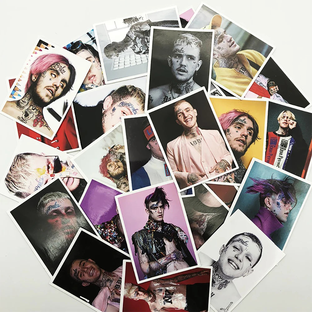 A collection of various graffiti-style stickers and decals featuring portraits and artwork on a white background.