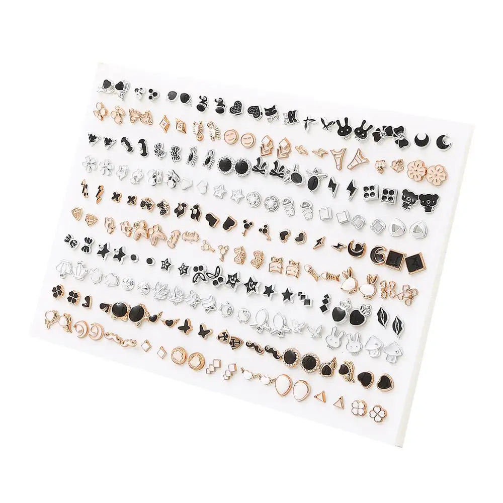 A display of assorted acrylic stud earrings featuring hearts, stars, moons, and various other designs.