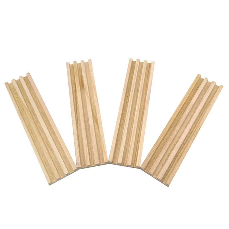 A set of four wooden domino racks used as premium tile holders for games.