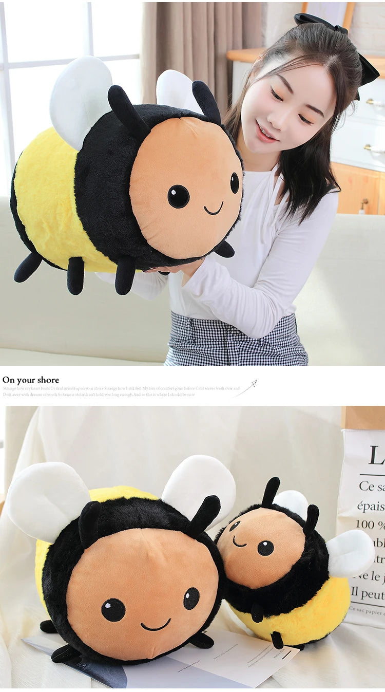 A plush toy of a bee and ladybug design with yellow and black coloring shown next to a woman.