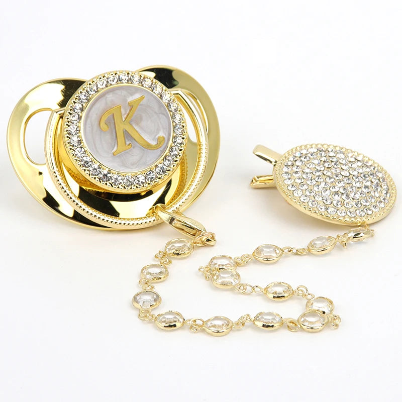 Gold initial K rhinestone pacifier with clip and chain necklace