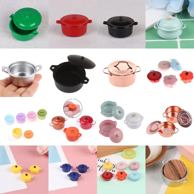 A collection of miniature copper and colored soup pots for a dollhouse kitchen display.