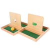 A wooden Montessori sensory toy set featuring two wooden blocks with holes and a green felt mat.