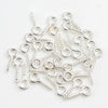 A collection of silver mini eye pins with screw threads for jewelry making