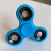 A bright blue ABS tri-spinner fidget toy with a clear center and black accents.
