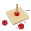 A wooden sensory toy set featuring a wooden dowel and red circular pieces for toddlers.