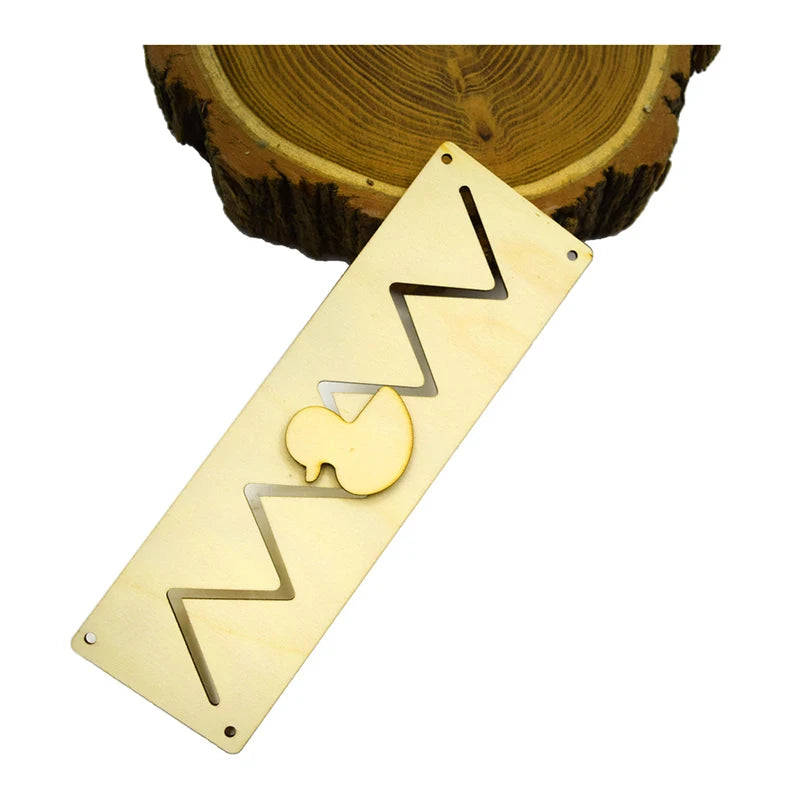 A wooden Montessori busy board with a wavy design and an apple cutout, placed on a cross-section of wood.