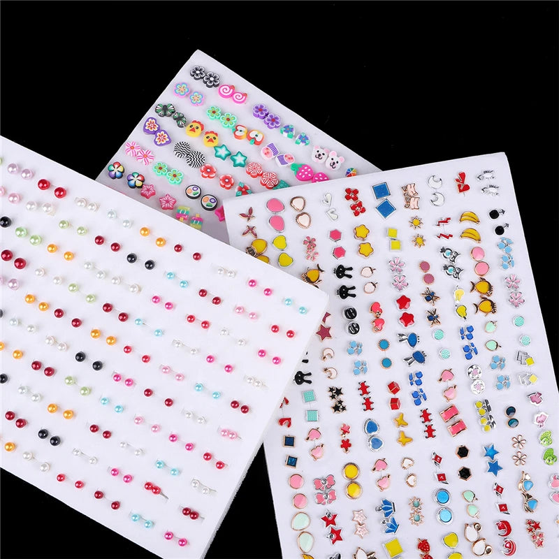 A collection of assorted acrylic stud earrings featuring hearts, stars, and moons in various colors and styles.