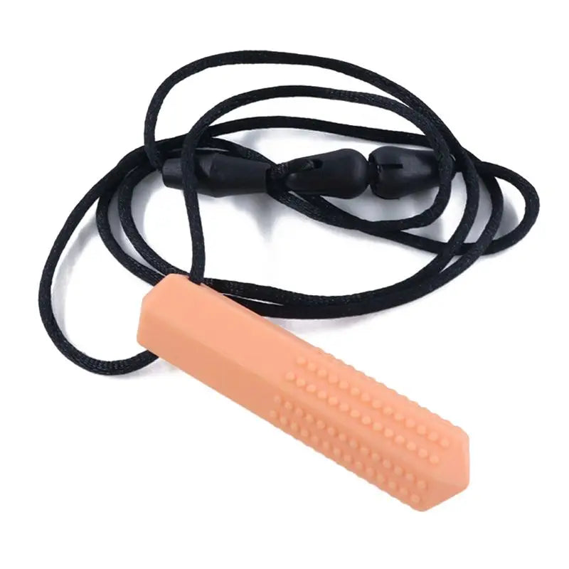 A silicone chew necklace with a peach-colored silicone piece and a black cord.