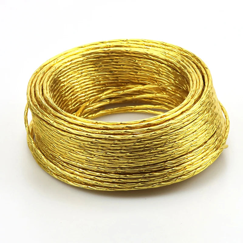 A coil of flexible gold-colored aluminum craft wire used for jewelry making and DIY projects.