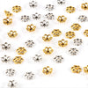 A collection of small, hollow flower bead caps in gold and silver finishes for jewelry making.