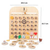 A wooden daily calendar board showing the month of January with numbered days and various icons for learning.