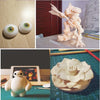 A set of soft polymer clay eyeballs and a detailed sculpture of a mythical creature.