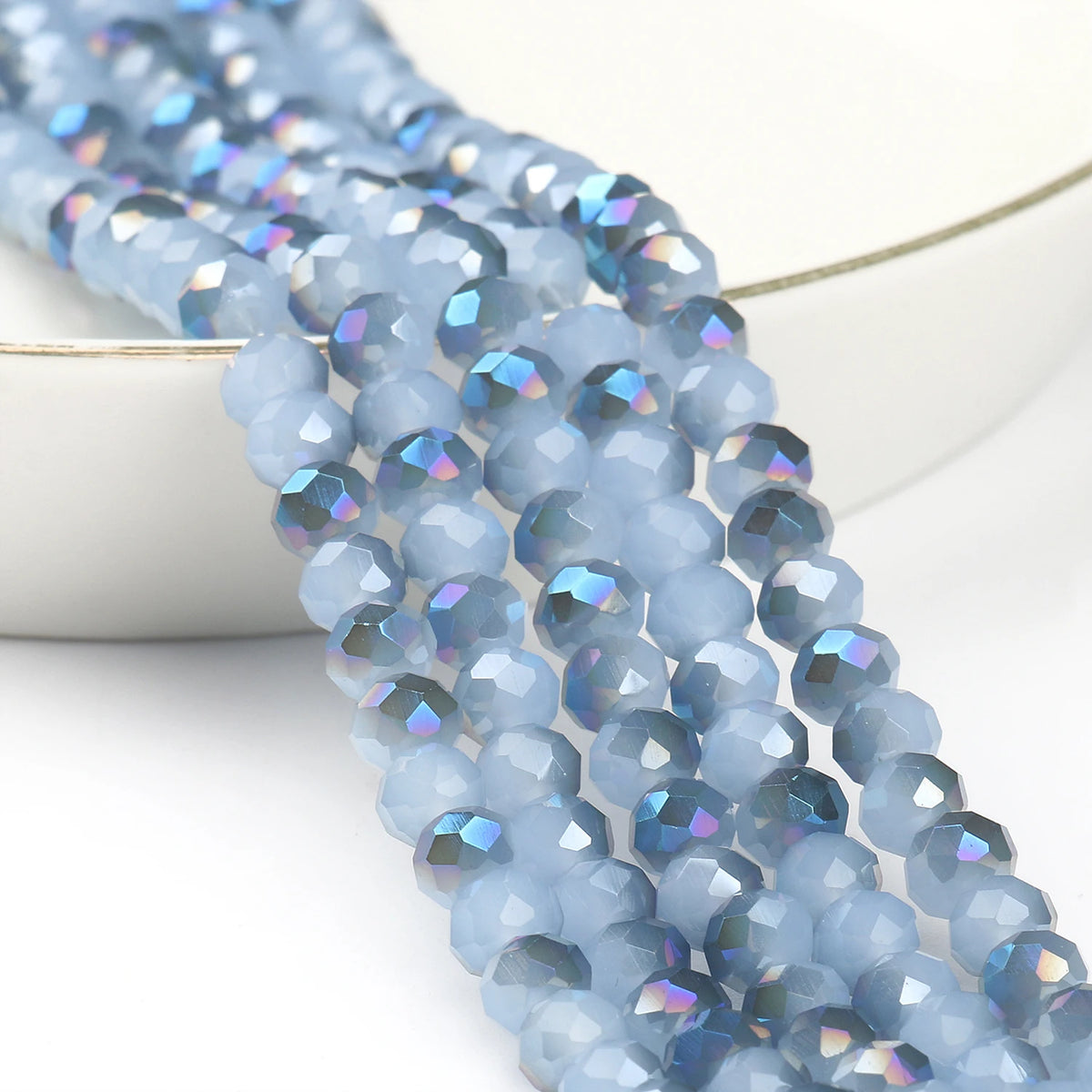 A strand of light blue faceted crystal glass beads for jewelry making