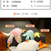 A collection of oversized, colorful goose plush toys and pillows in various sizes displayed on a surface.
