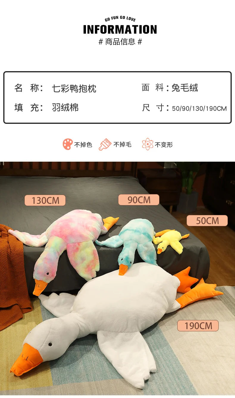 A collection of oversized, colorful goose plush toys and pillows in various sizes displayed on a surface.