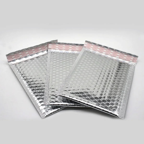Stack of silver aluminum foil bubble mailer bags