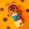 A set of Creative Animal Friends building blocks featuring a brown and pink tiger figure on an orange background.