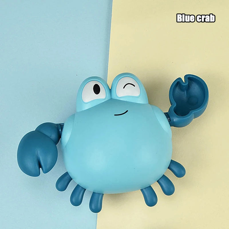 A blue crab toy featuring claws and a body, set against a light yellow background.
