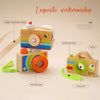 A wooden camera teether toy with colorful parts and strips for babies.