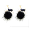 Pair of black mink fur pom poms with gold accents for crafts and accessories