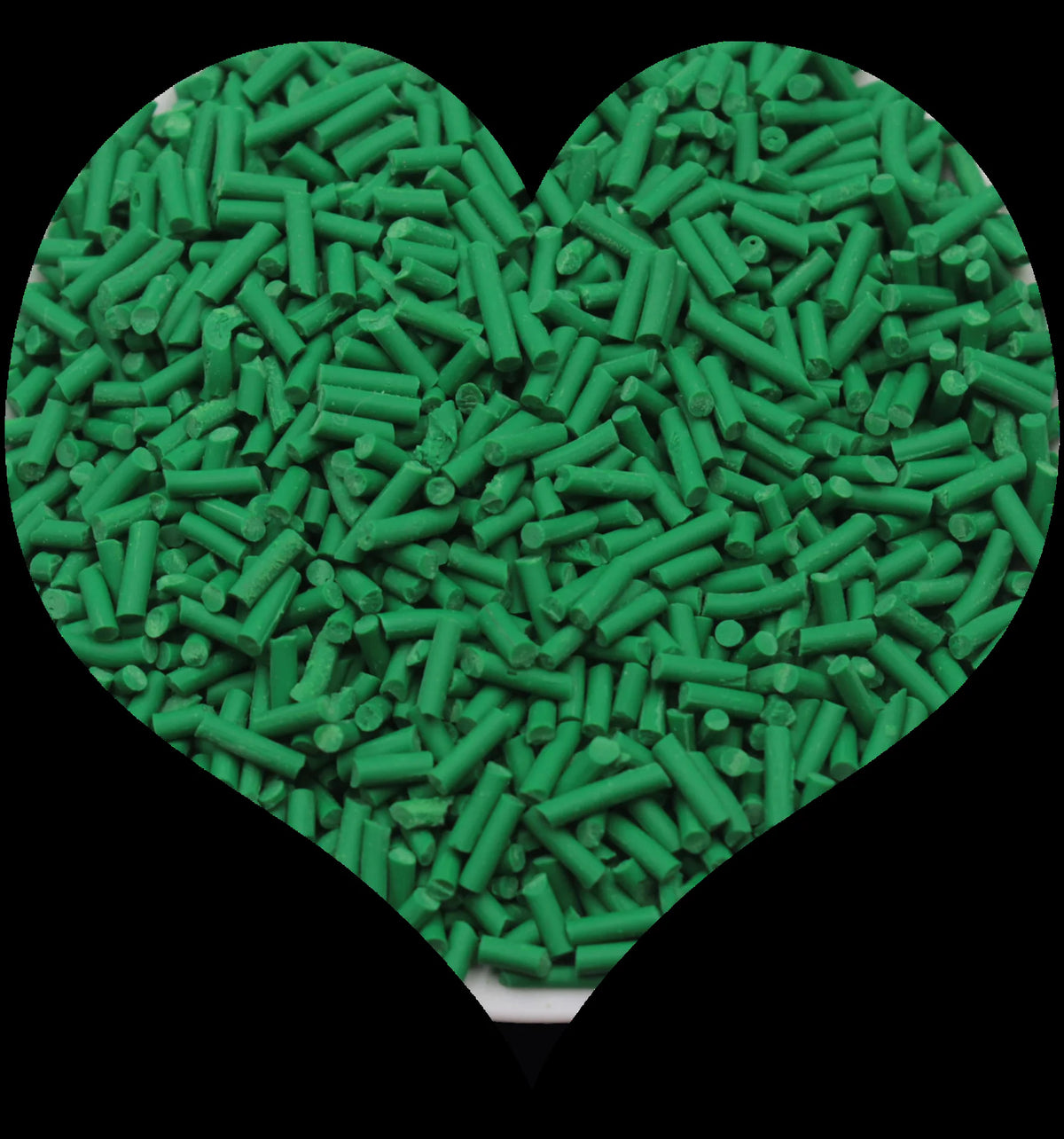 A heart shape filled with green soft polymer clay candy sprinkles for cake decorating