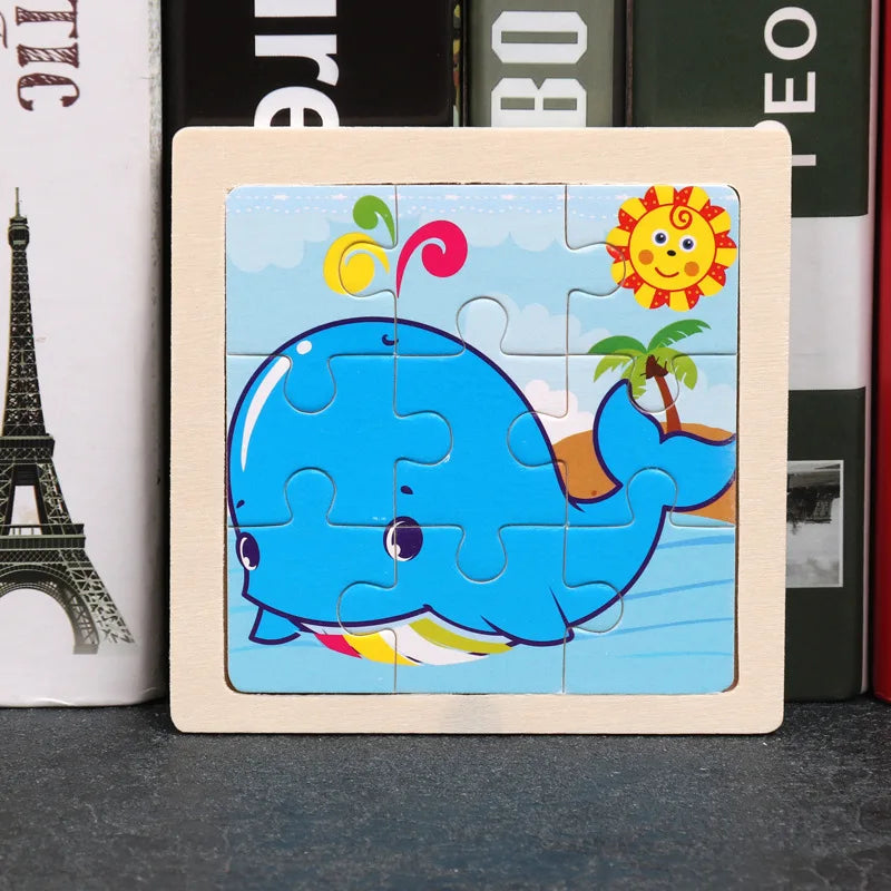 A wooden jigsaw puzzle featuring a blue whale and a sun design.
