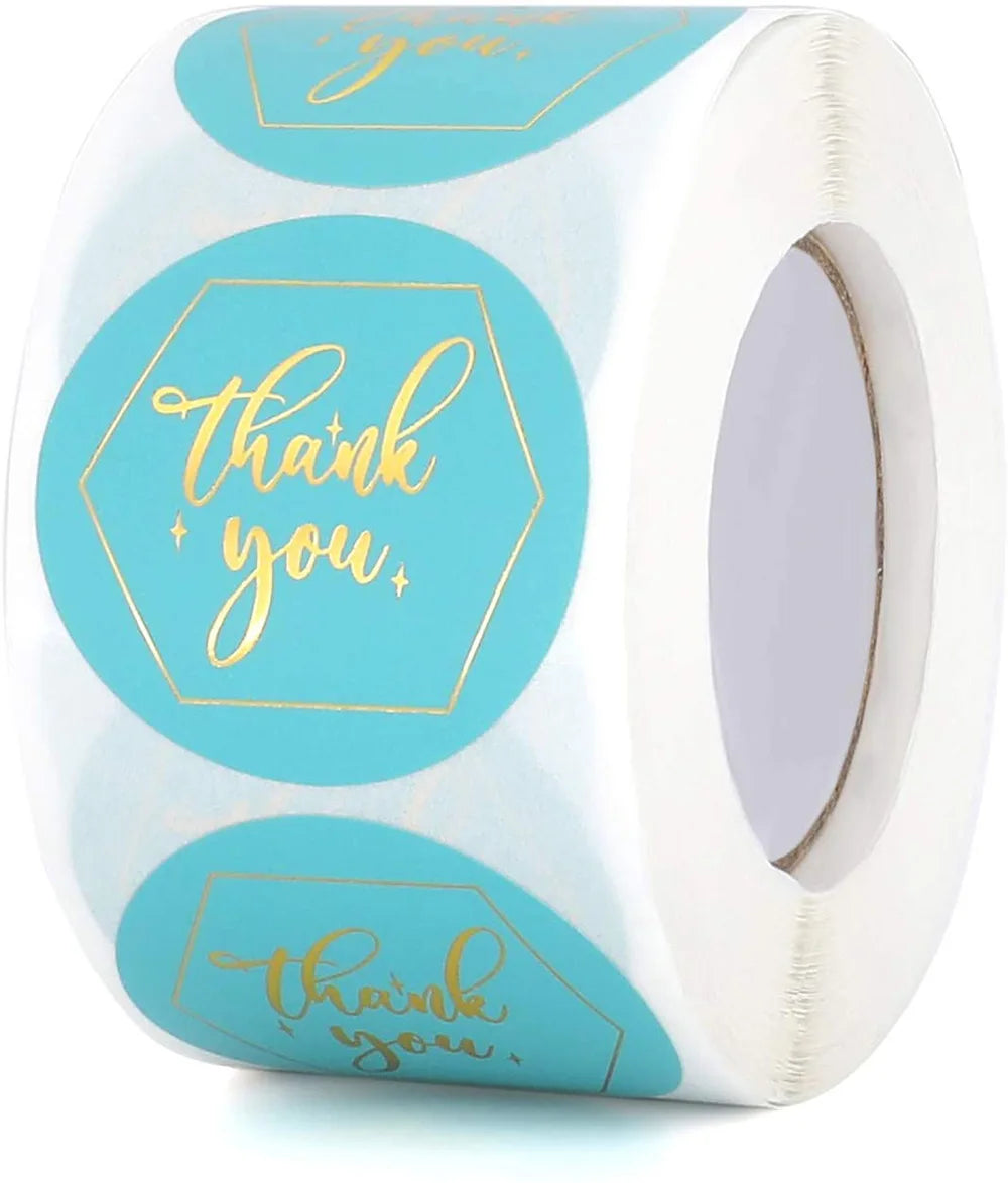 Roll of round teal thank you stickers with gold lettering for gifts and packaging