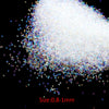 A pile of tiny, iridescent glass bubble beads ranging in size from 0.8 to 1 millimeter.