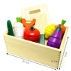 A wooden magnetic fruit and vegetable cutting play set with various colored fruits and vegetables inside a wooden box.