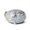 A gray and white seal plush toy with a round body and facial features.