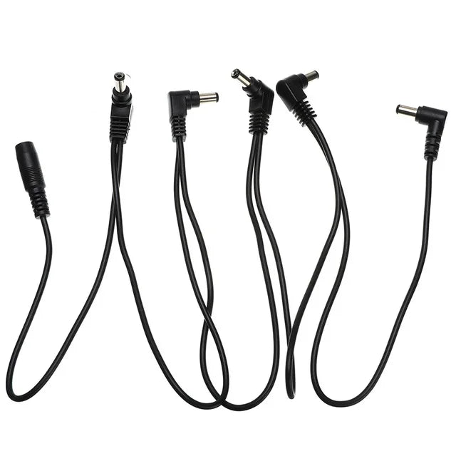 A set of guitar pedal power daisy chain cables with various connectors.