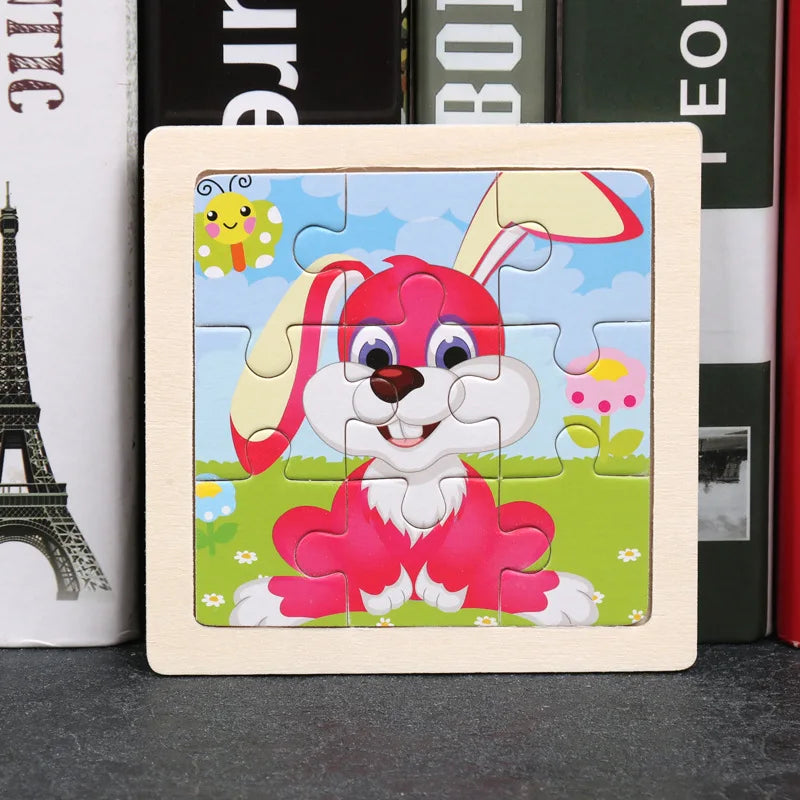 A wooden jigsaw puzzle featuring a pink rabbit character in a green field with colorful flowers.