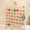 A wooden daily calendar board for kids featuring numbered days, weather icons, and activity symbols.