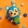 A Lego minifigure of a blue and white animal character standing on an orange background with small flower-shaped pieces.