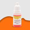 A small bottle of pink liquid soap colorant labeled Sunset Yellow for DIY projects.