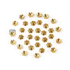 A collection of small, gold-colored Tibetan style hollow flower bead caps for jewelry making.