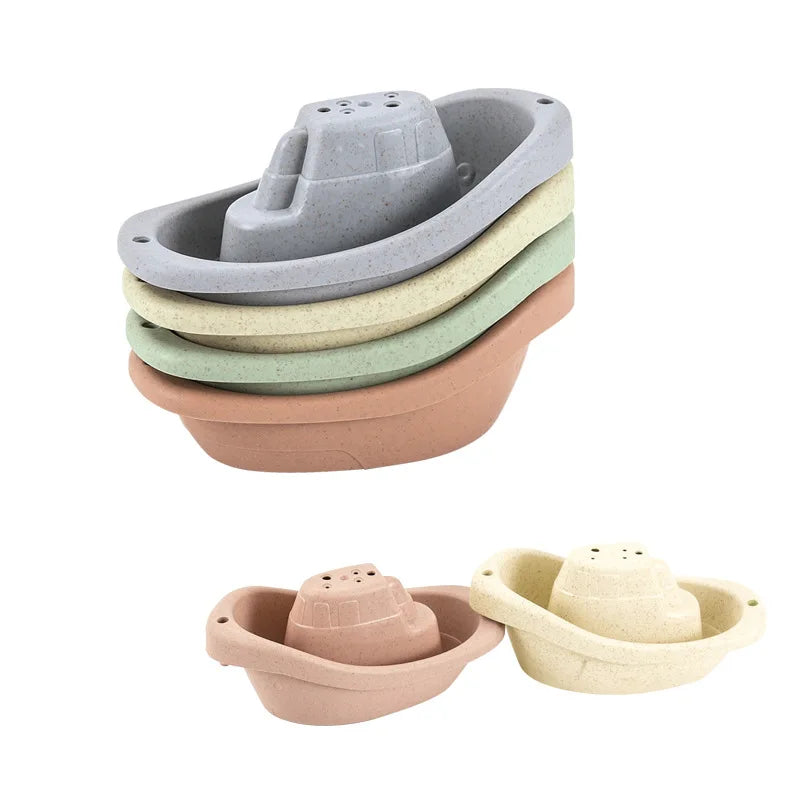 A set of five boat-shaped stacking cups for toddlers in various muted earth tones.