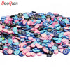 Assortment of colorful soft polymer clay slices for nail art and DIY crafts