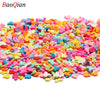 A pile of colorful soft polymer clay slices assorted in various shades of pink, blue, green, and orange for nail art and DIY 